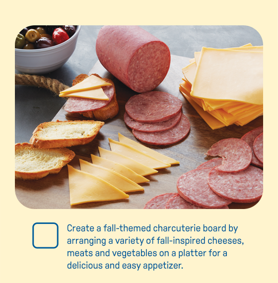 Create a fall-themed charcuterie board by arranging a variety of fall-inspired cheeses, meats and vegetables on a platter for a delicious and easy appetizer.